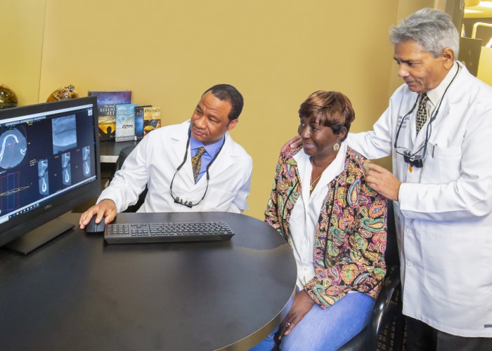 Doctors at Winterset Dental consult with a Patient