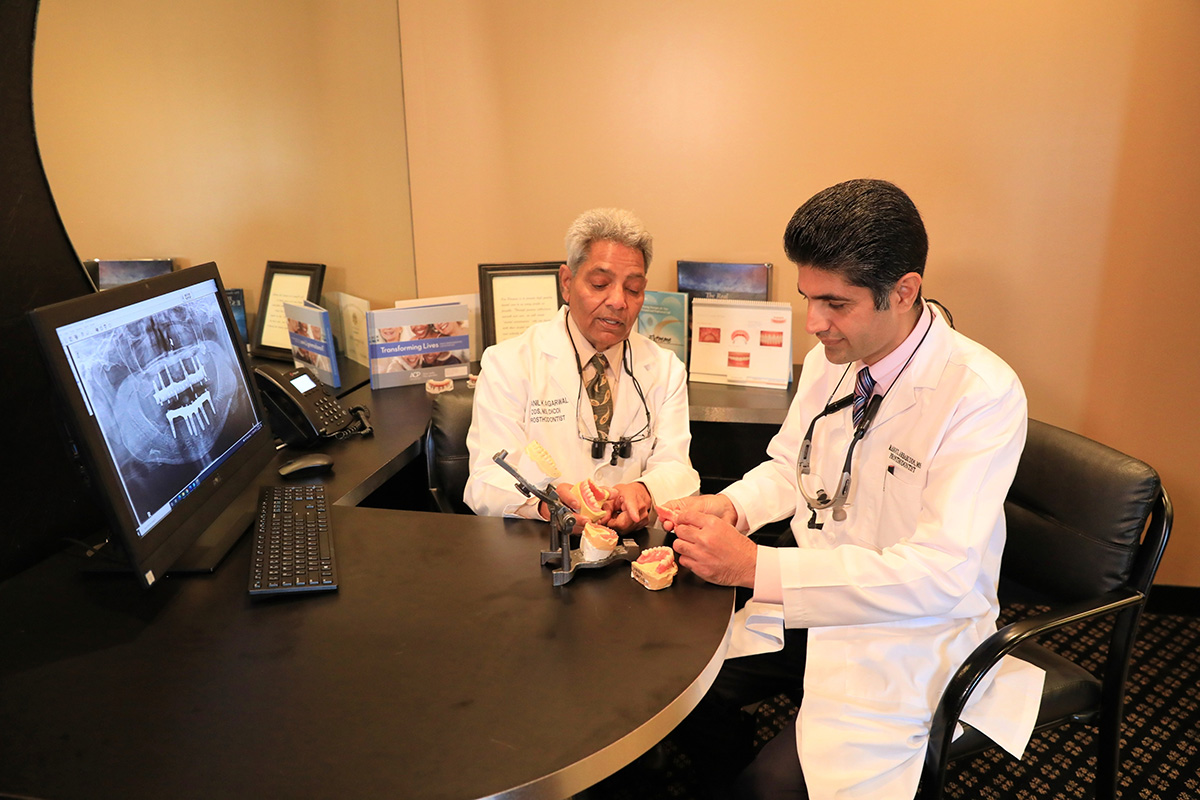 Dentists producing dentures together