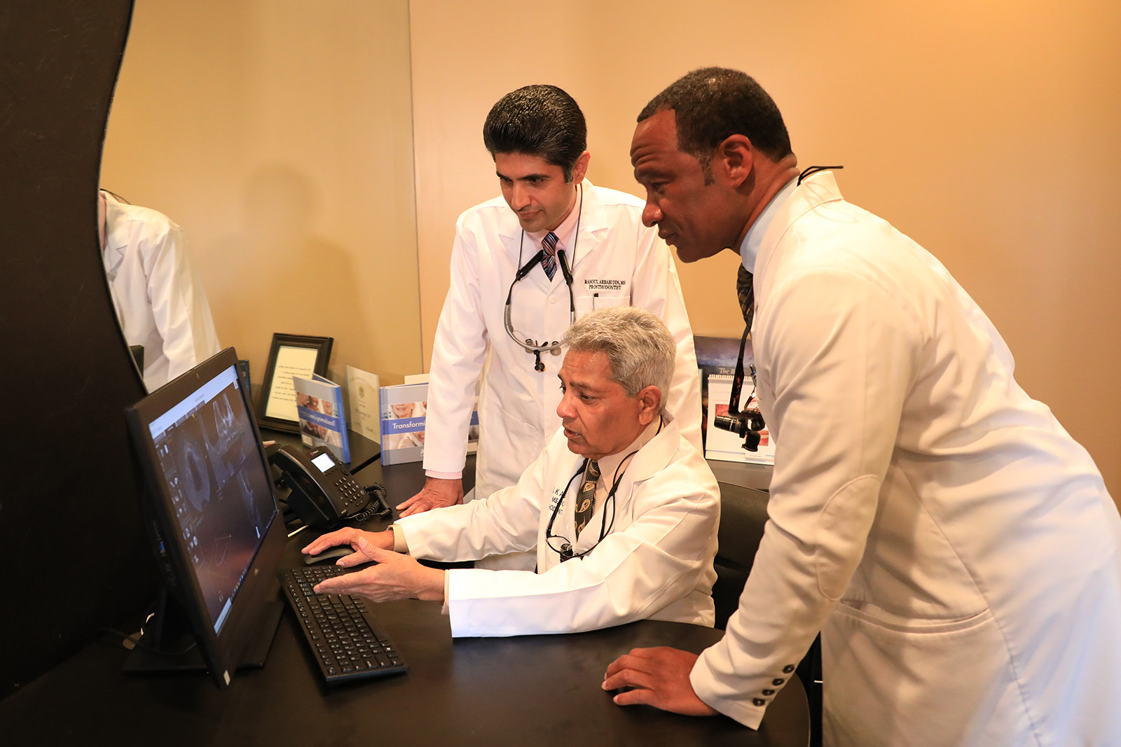 Drs. of Winterset examine a computer screen