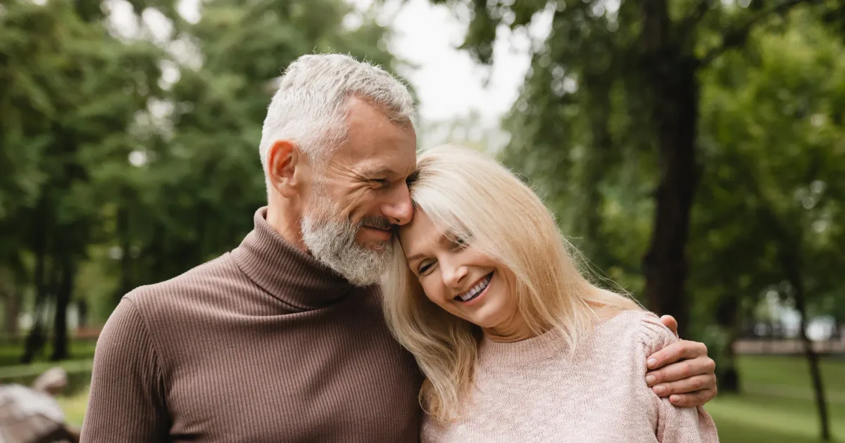 Smiling older couple together outdoors