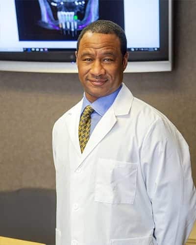 Portrait image of Dr. Hector E. Cummings Jr., Board-Certified Periodontist.